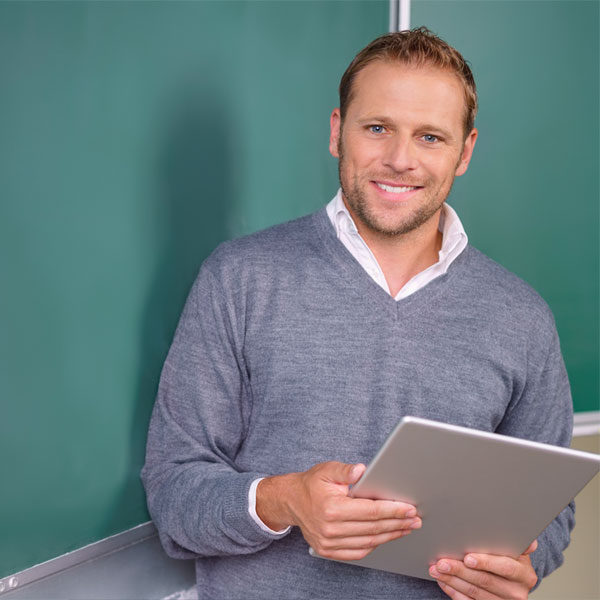 Teacher using tablet in classroom